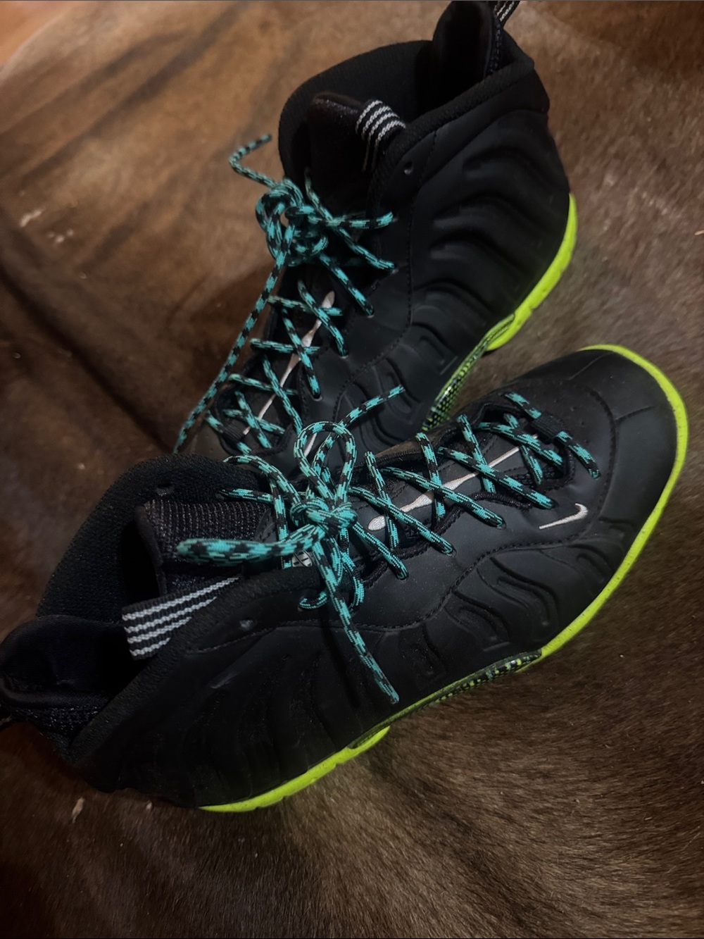Nike Kids Black Sneakers with Neon Green Soles and Teal Laces